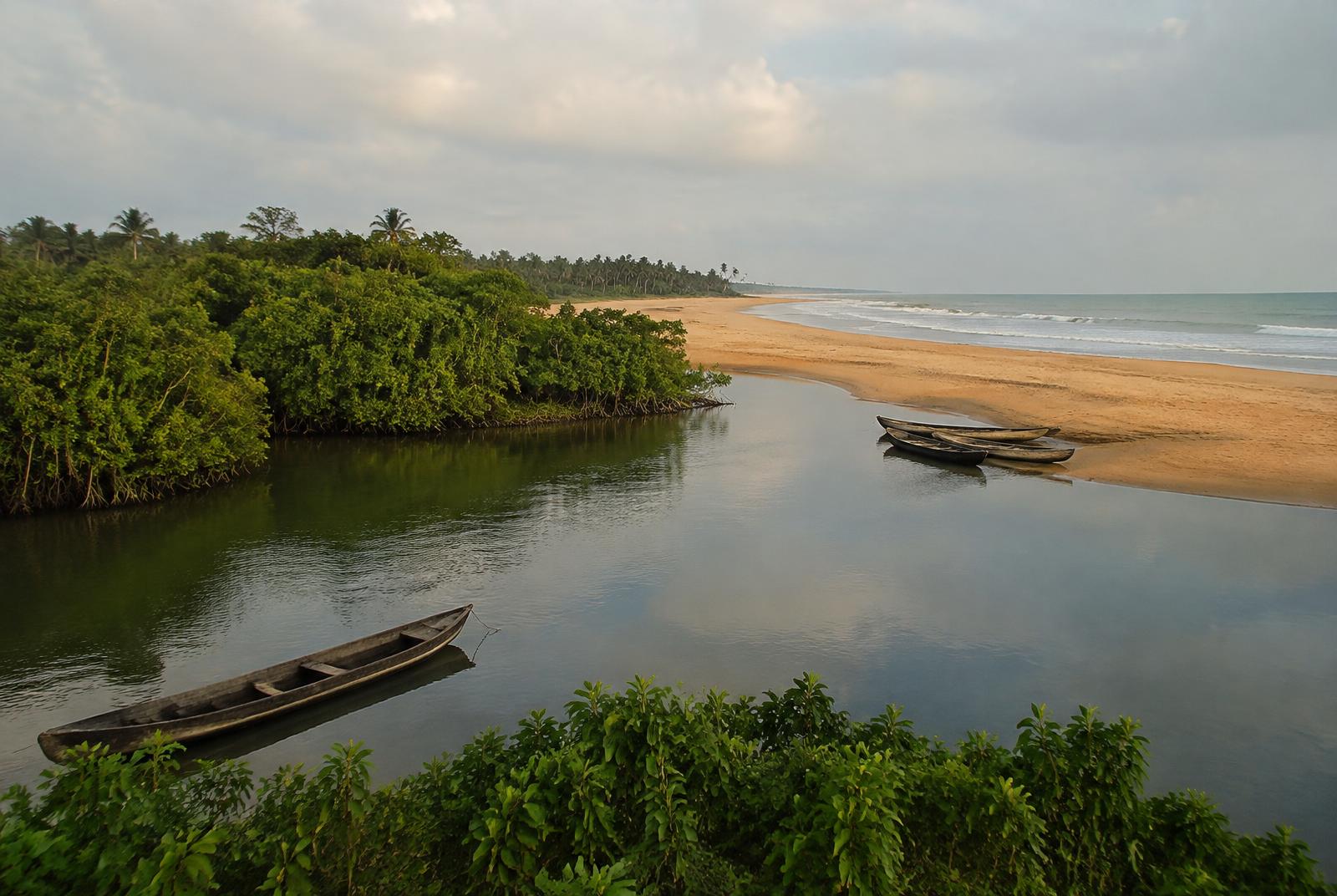 Quiet river mouth meeting the Atlantic — editorial perspective